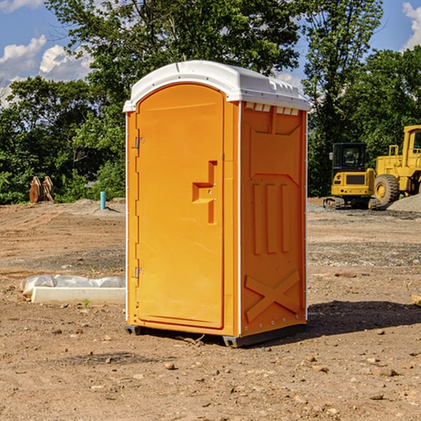 what is the cost difference between standard and deluxe portable restroom rentals in Muskingum
